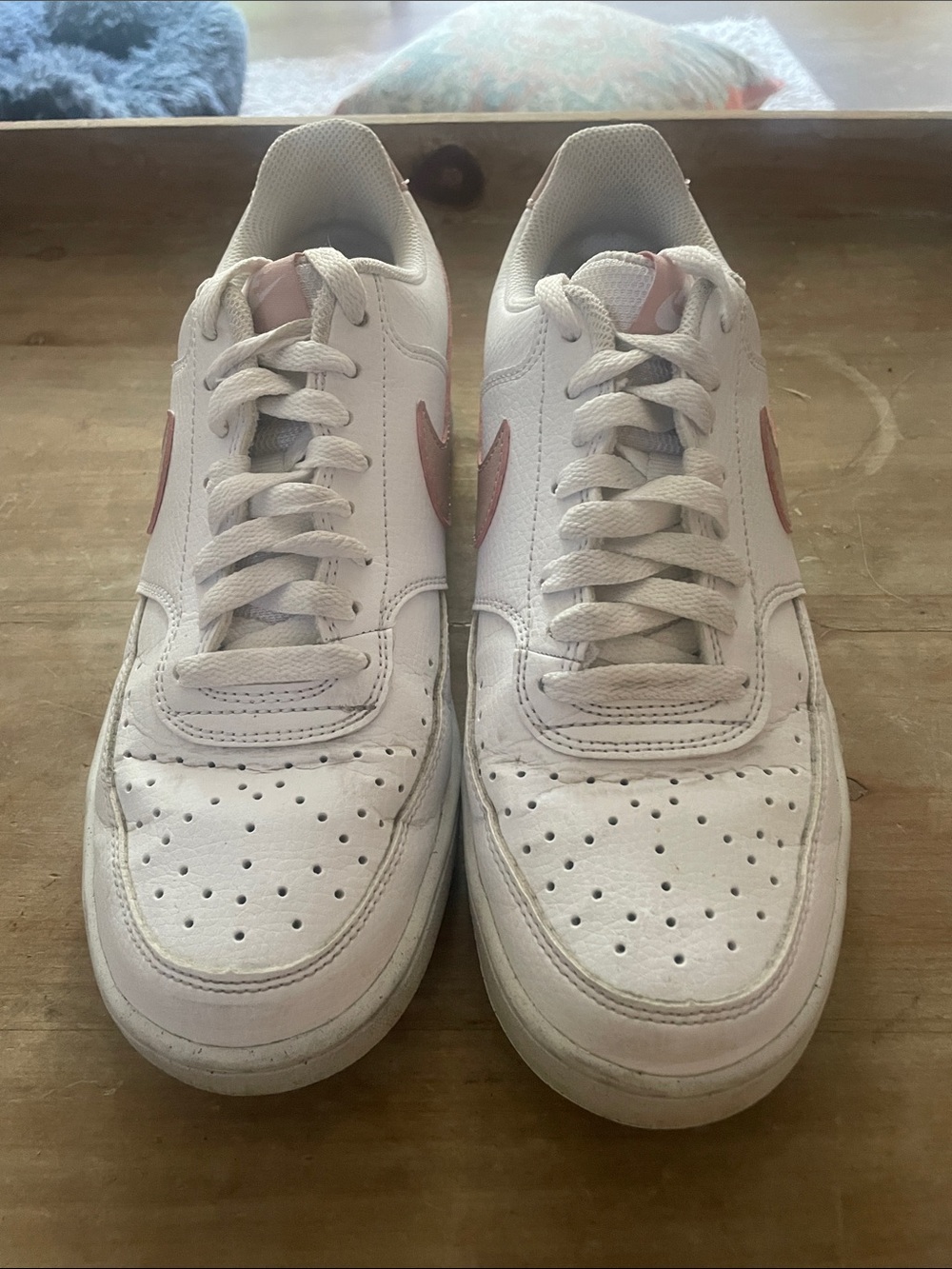 Nike White Sneakers with Pink Swoosh Accents